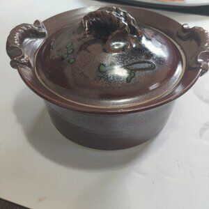 Caserole covered pottery dish in high gloss redware.